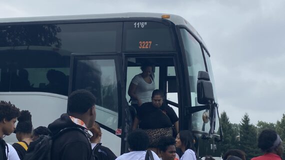 Image of families disembarking from a bus at Dorney Park