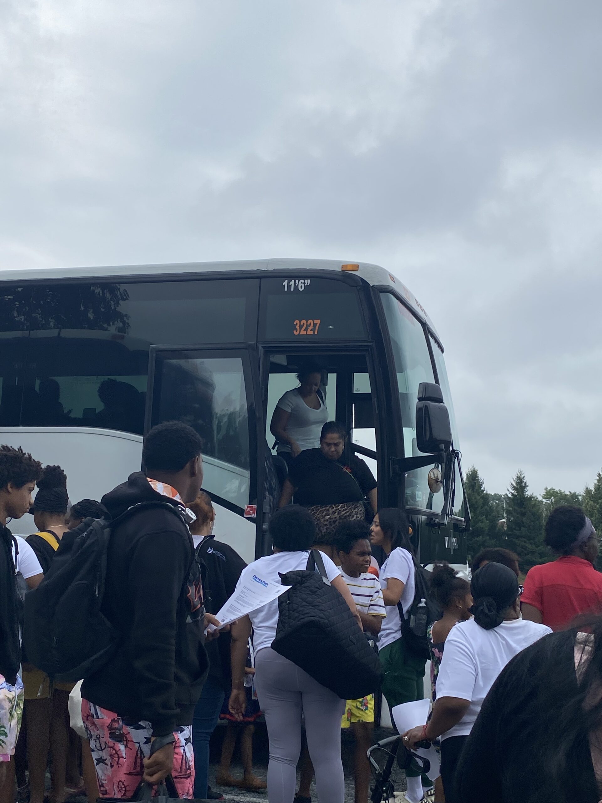 Image of families disembarking from a bus at Dorney Park